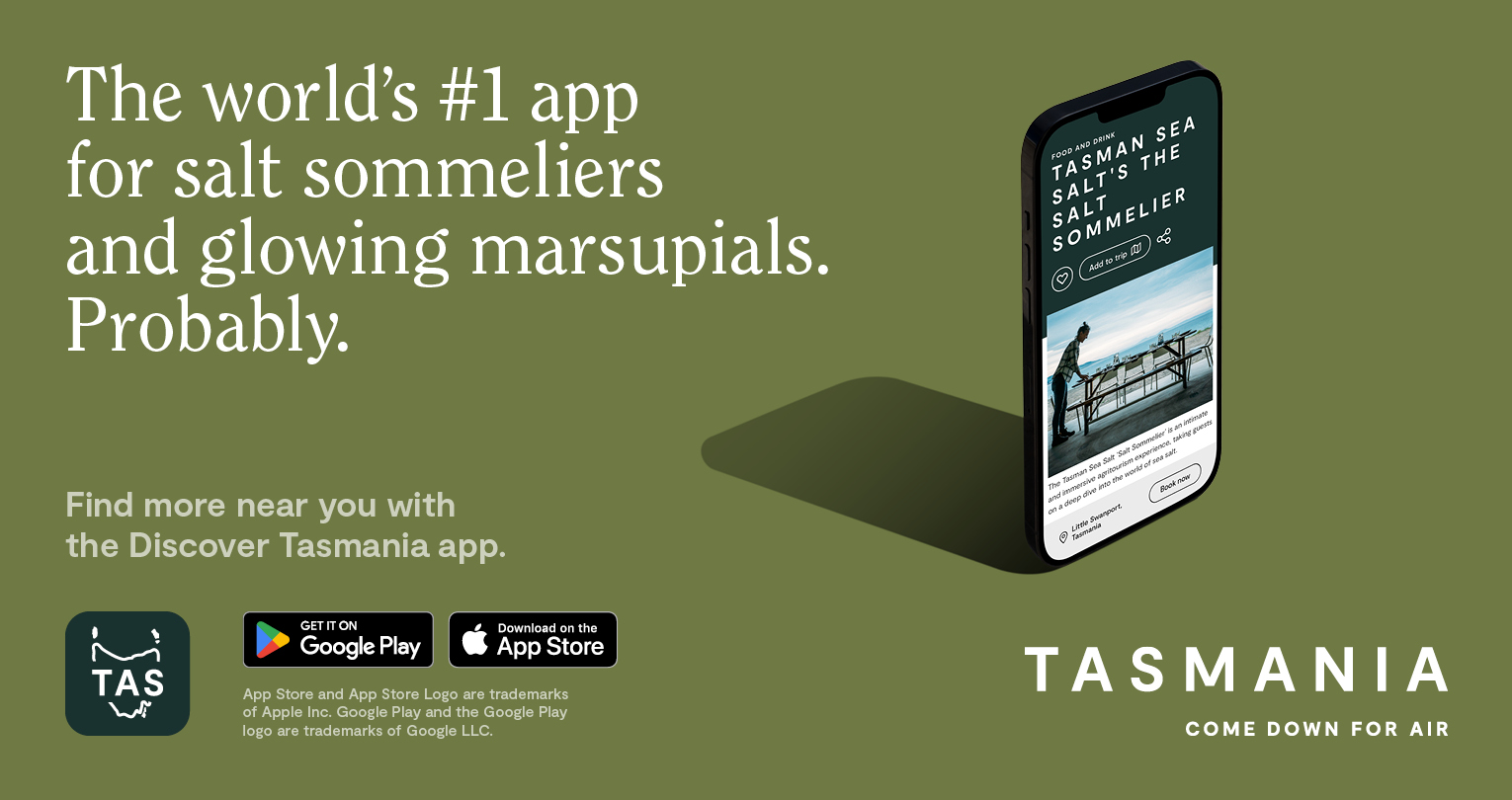 An olive green banner for the Discover Tasmania app with the text 'The world's #1 app for salt sommeliers and glowing marsupials. Probably."