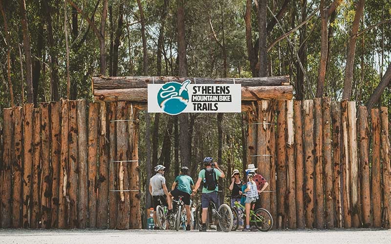 Mountain riders line line up at the trail entrance